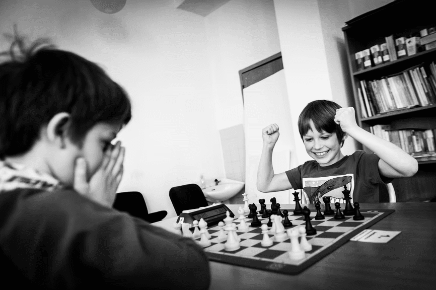 Young people playing chess