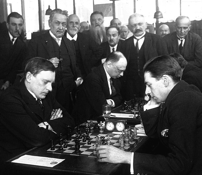 Alexander Alekhine plays a chess game
